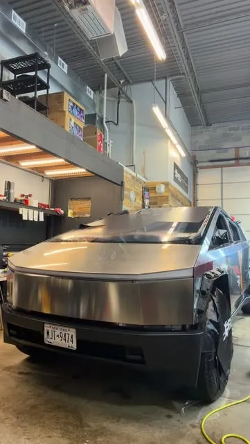 Cybertruck being wrapped in the Nash install bay
